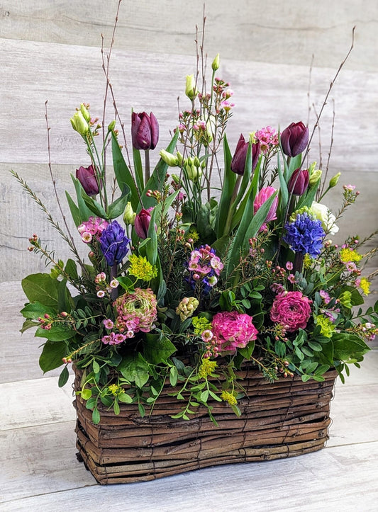 Spring Garden Flower Arrangement In A Wooden Trough