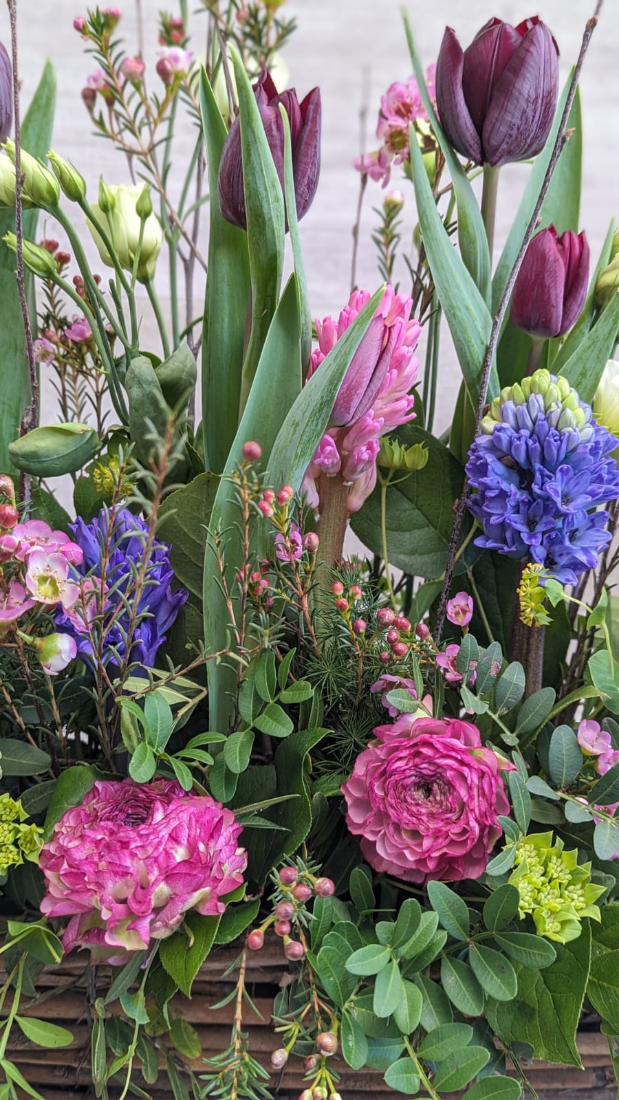 Spring Garden Flower Arrangement In A Wooden Trough