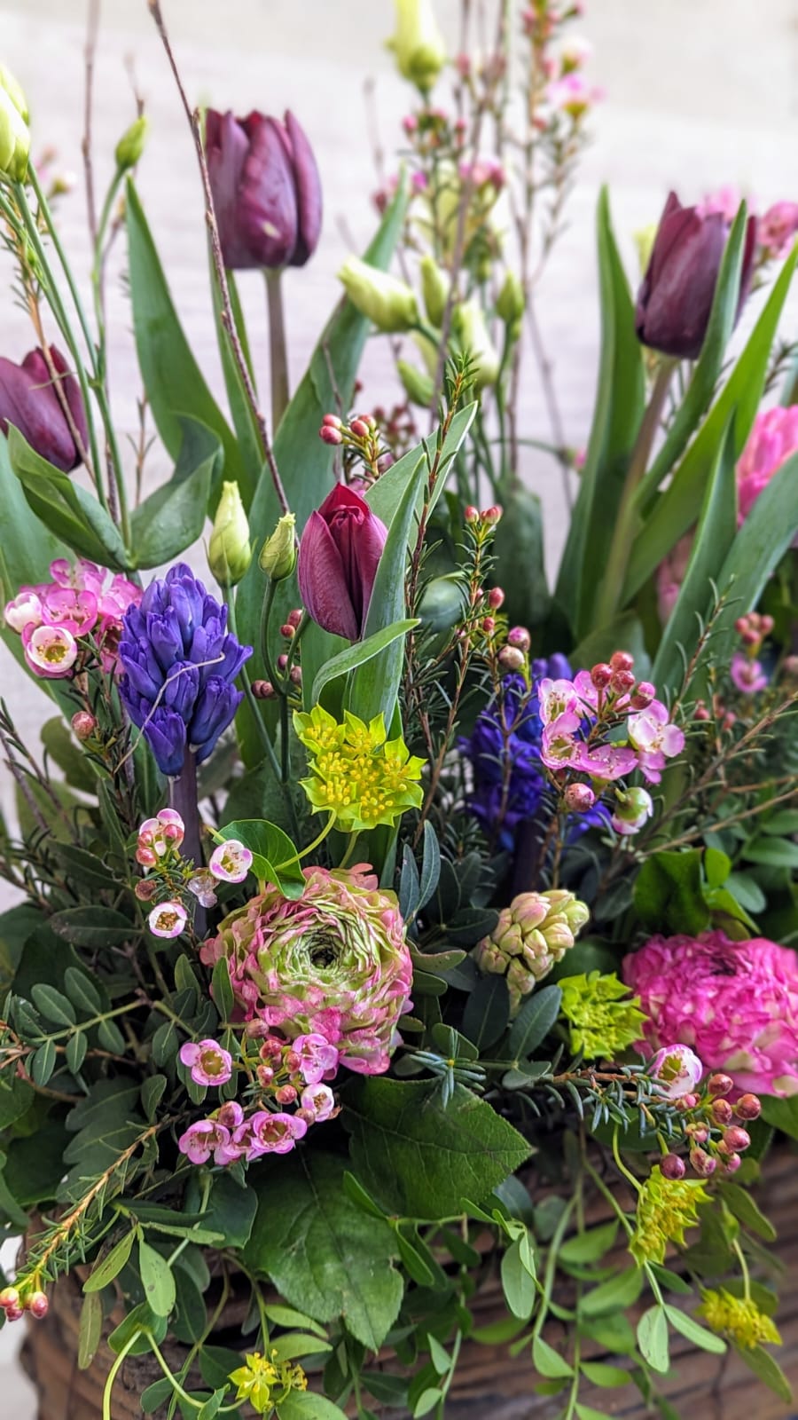 Spring Garden Flower Arrangement In A Wooden Trough